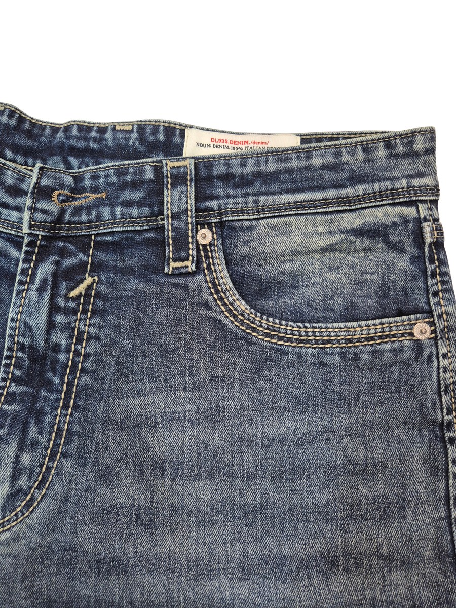 Close view of the waistband, coin pocket and contrast topstitching